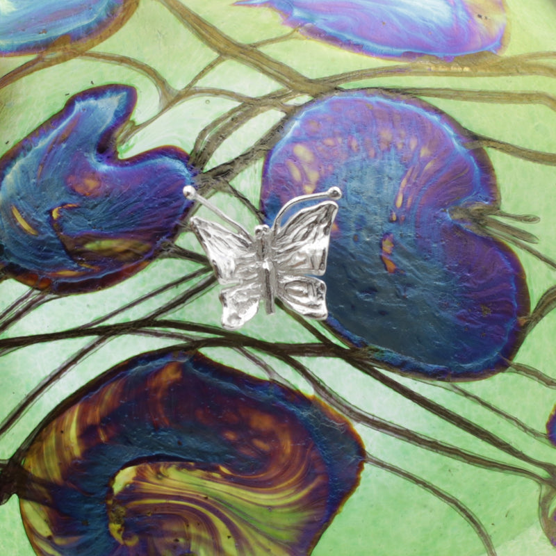Butterfly on lily trail disc