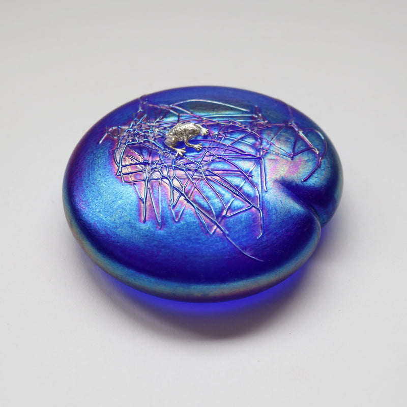 Handmade glass lily leaf shaped paperweight in cobalt blue with sterling silver frog