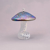 Silver fairy sitting on a handmade glass iridescent toadstool 