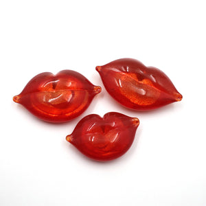 Handmade glass bright red lips.
