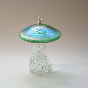 Silver fairy sitting on a handmade glass iridescent green toadstool 