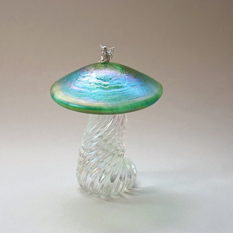 Silver fairy sitting on a handmade glass iridescent green toadstool 