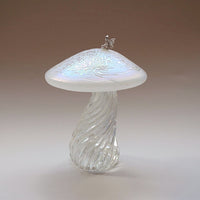Silver fairy sitting on a handmade glass pearl iridescent toadstool 