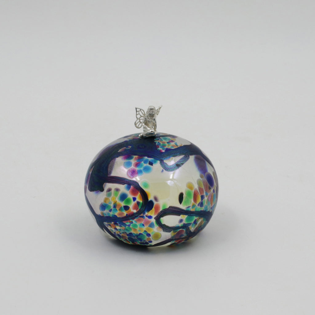 tuffet shaped paperweight with sterling silver fairy sitting on top