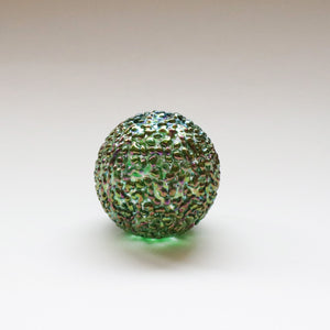 iridescent green speckled glass paperweight